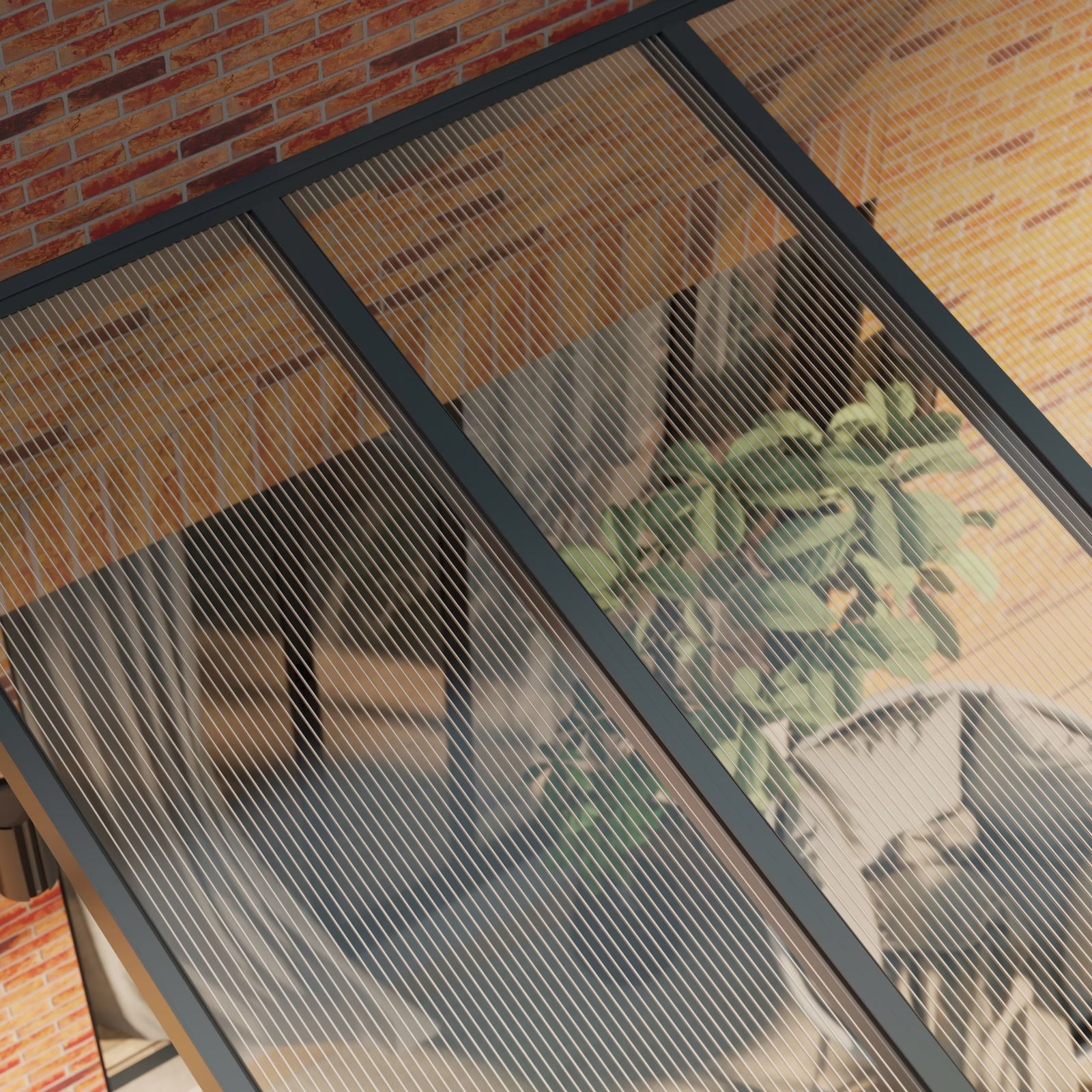 Terrassenüberdachung mit klarem Polycarbonatdach und anthrazitfarbenem Rahmen